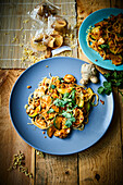 Egg noodles with zucchini and peanut sauce