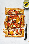 Vegetarian tart with cherry tomatoes, olive tapenade and goat cheese