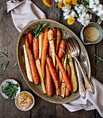 Roasted carrots and parsnips with honey, rosemary and tahini dressing