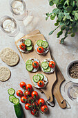 Oatcakes with cream cheese, cucumber and cherry tomatoes