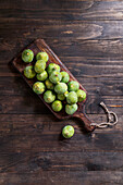 Green ripe figs on rustic wooden table
