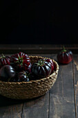 Purple tomatoes in a wicker basket