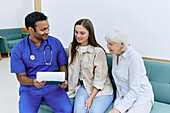 Doctor talking to patient and family