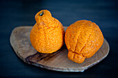 Sumo tangerines (also known as sumo citrus or dekopon )