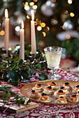 Christmas appetizer and cocktail on candlelit table