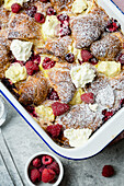Croissant casserole with raspberries, cream cheese, and maple syrup