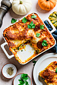 Pumpkin and spinach lasagna with ricotta and mozzarella cheese