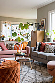 Cozy living area with stylish decorations and plant accents