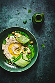 Hummus with cucumber and peas