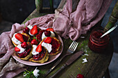 Poppy seed pancakes with cherries, strawberries, and yogurt