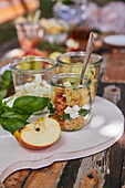 Apple sauce with feta and basil in a glass