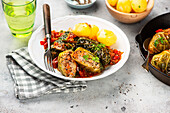 Savoy cabbage roulades in a delicious tomato sauce with potatoes