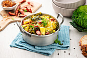 Savoy cabbage stew with potatoes and smoked sausages