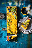 Mango mousse cake decorated with fresh fruit