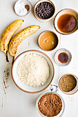 Ripe bananas and bowls with various ingredients