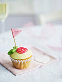 Small cupcake with frosting rose