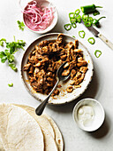 Burritos- meat filling, jalapeno and pickled onions