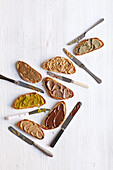 Nut butter variations with kernels, peanuts, hazelnuts, almonds, pistachios and chocolate