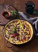 Red onion quiche with cheese and cumin