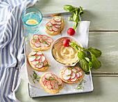 Open sandwiches with anchovy butter, radish and dill