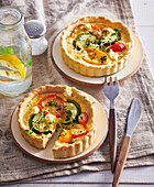 Mini quiche with vegetables and feta cheese