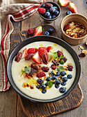 Semolina porridge with fruit and pecans