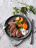 Lamb fillets with wild herb pesto and sweet potatoes