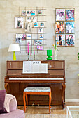 Piano, decorative wall grille and wall-mounted magazine rack