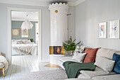 Bright living room with fireplace and view of the neighbouring bedroom