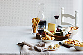 Cheese board with crackers and wine