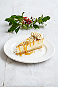 Christmas cheesecake with salted caramel almonds and whipped cream