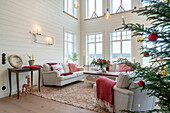 Living room with Christmas decorations, Christmas tree and view of the countryside