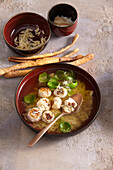 Chicken broth with meatballs and brussels sprouts