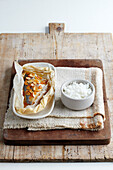 Sea bass cooked in parchment with apricots and almonds