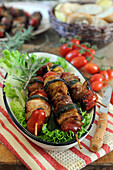 Grilled skewers with chicken, zucchini and tomatoes