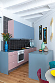 Custom-made kitchen in grey and pink