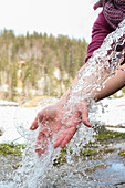 Rinsing your hands in cold water in nature