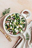 Spring salad with asparagus, radish, feta, cucumber and butter beans