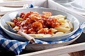 Penne with tomato sauce and shrimp