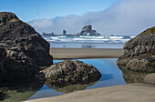 A Tide Pool Reflects The Sky; Cannon Beach, Oregon, United States Of America