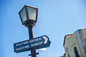 Sign For The Maritime Museum On A Lamp Post; Chania, Crete, Greece