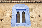 View Of Blue Painted Window Set In Rustic Wall; Chefchaouen, Morocco