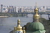 Domes Of The Lower Lavra Of The Caves Monastery With The River Dnipro And Eastern Suburbs Beyond; Kiev, Ukraine