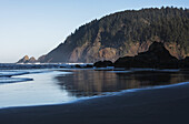 Morning Sunlight Warms Tillamook Head; Cannon Beach, Oregon, United States Of America