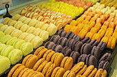 Close Up Of Colourful Macaroons In A Bakeries Display Case; Morlaix, Brittany, France
