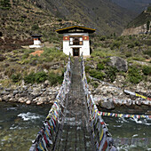 Suspension Bridge Made From Wood And Chain Across Paro River, Near Tachog Lhakhang Dzong; Paro, Bhutan