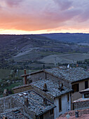 Sunset Over Farmland With Houses In The Foreground; Orvieto, Umbria, Italy