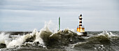 Lighthouse And Splashing Waves; Amble, Northumberland, England