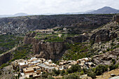 Mountainous Landscape With Village And Terraced Fields Of Roses