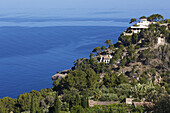 Sea View With Tree Covered Promontory And Villa From The Coastal Road Between Soller And Pollenca, Mallorca